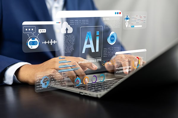 person working on a laptop with projected screen windows including AI