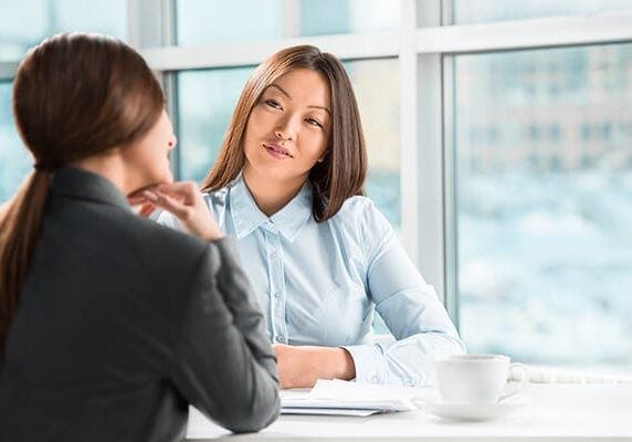 coach listening to client at a table