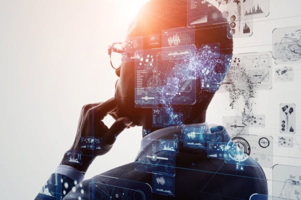 man pondering with overlay of technological drawings