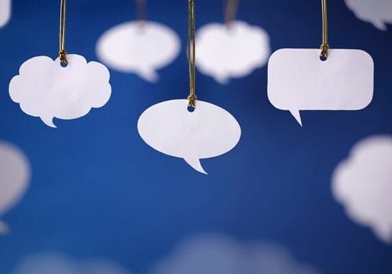speech bubbles tied on strings hanging