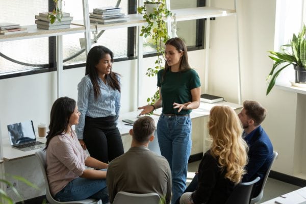group coaching sessions with two people standing